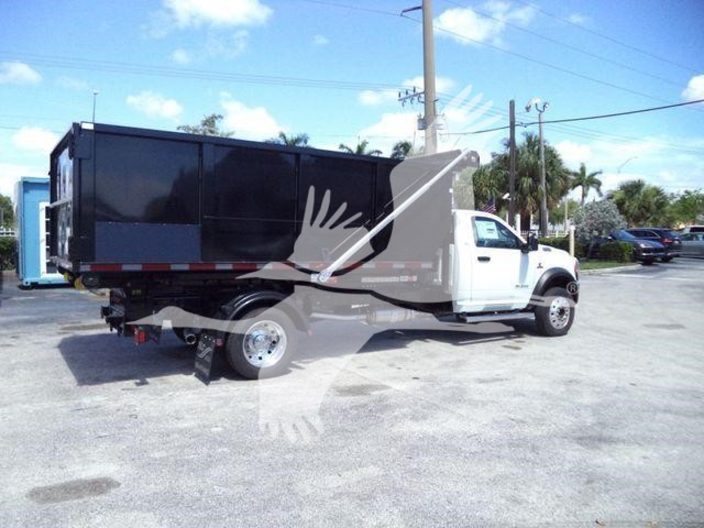 Ram 5500HD truck with dump bed showing side and rear view.
