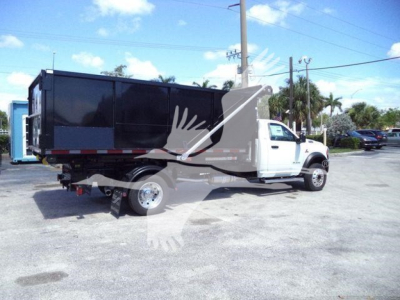 Ram 5500HD truck with dump bed showing side and rear view.