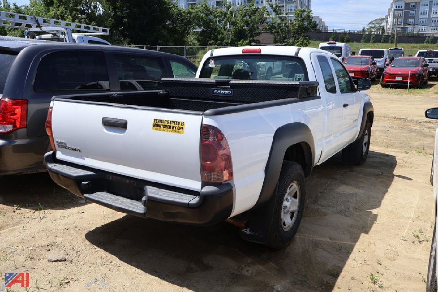 Toyota Tacoma pickup truck 2014 white 4x4 rear view in a lot with a bed cap and sticker on tailgate