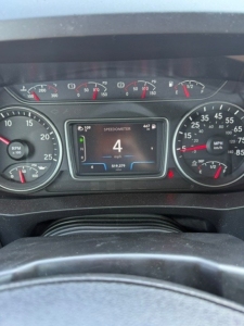 Dashboard of 2021 International LT625 showing speedometer and digital display reading 4 mph.