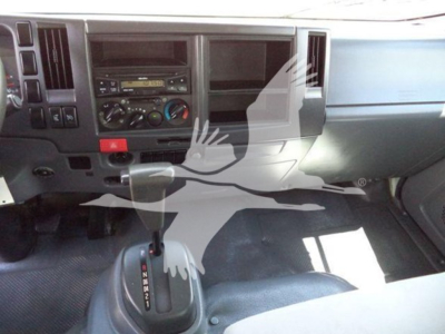 Isuzu NPR-HD truck interior showing dashboard controls and manual gear shifter
