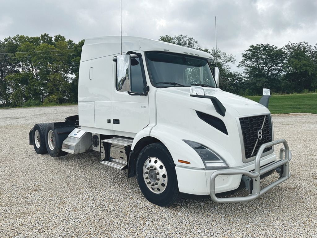 Volvo VNR 640 truck cab in white, front-right view, with grille guard and side steps visible.