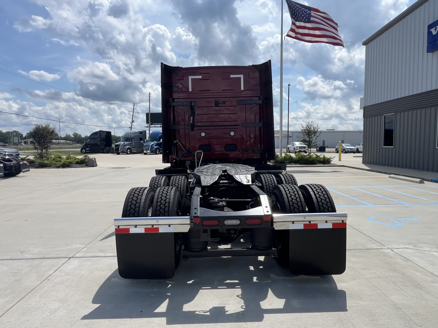 Back view of a 2026 Volvo VNL64T840 tractor showing rear wheels and fifth wheel mount.