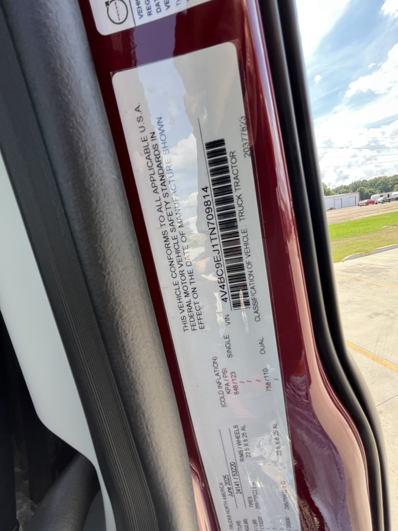 Vehicle identification label on Volvo VNL64T840 cab door jamb showing VIN and compliance text.