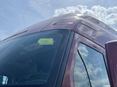 Volvo VNL64T840 truck cab window and windshield showing stock tag 70161