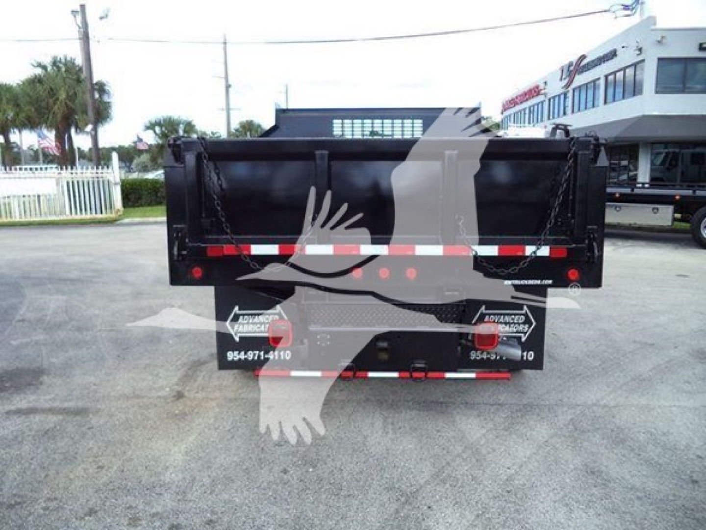 Dump truck bed of a 2018 Ford F550 XL rear view showing dump bed and taillights.