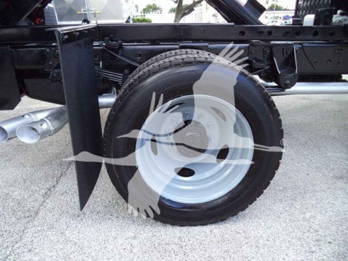 Ford F-550 chassis area showing spare wheel and frame rail