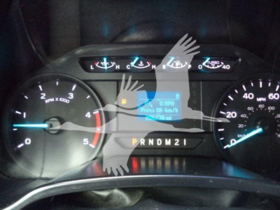 Dashboard of a Ford F-550 showing tachometer, speedometer, and gear selector with illuminated warning icons.