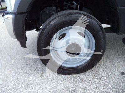 Ford F-550 front wheel and fender. Visible text: none besides wheel hub area, tire sidewall; no legible labels or serials in image.