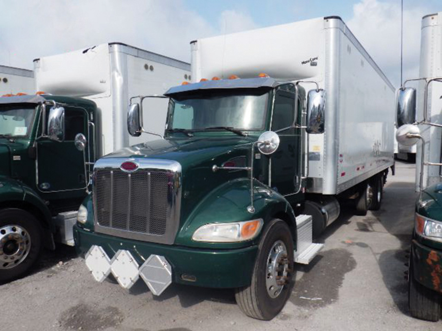 Peterbilt 348 2020 conventional daycab truck front view with green cab and white box trailer, stock number 552805, VIN 2NP3KM8X1LM668647.