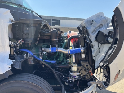 Volvo VNL64T860 engine bay showing turbocharged engine and blue silicone hoses
