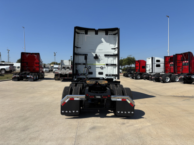 Volvo VNL64T860 trailer tractor rear view showing fifth wheel, dual rear axles, and mud flaps with Volvo branding.