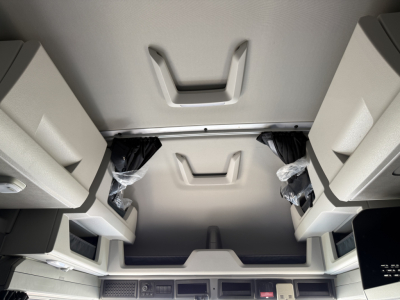 Interior overhead sleeper area of a Volvo VNL truck showing overhead storage compartments and ceiling panels.