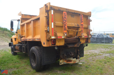 Dump truck bed and rear view of a 2007 International WorkStar 7300 dump truck showing warning stickers and rear hitch.