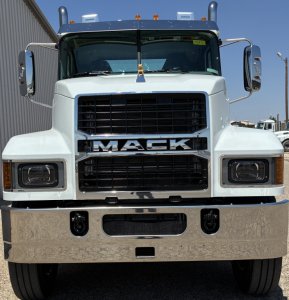 Mack PI64T truck front view showing large black grille with chrome Mack emblem and rectangular headlights