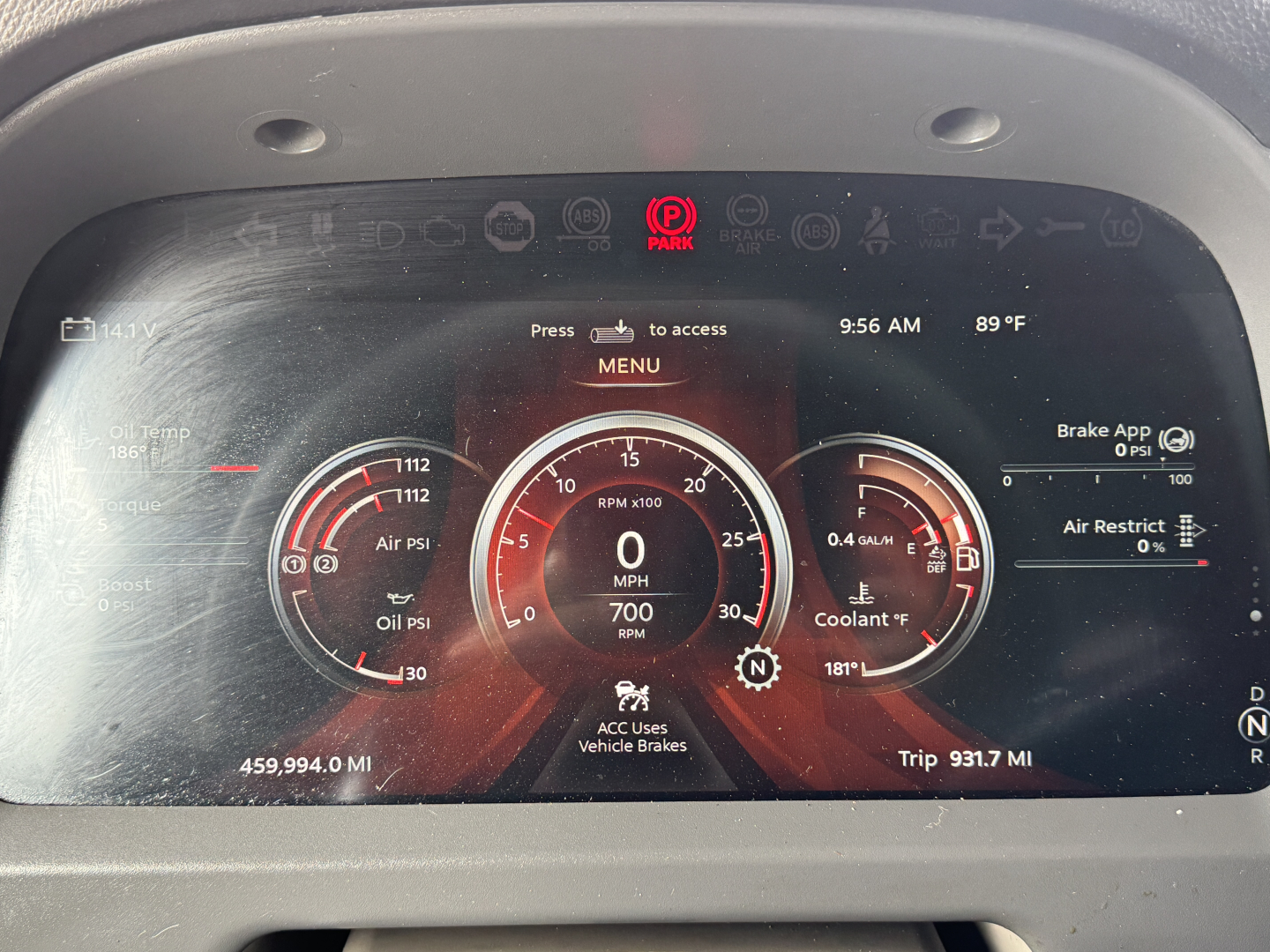 Dashboard display of a 2023 Peterbilt 579 showing digital gauges, RPM, speed, and trip mileage in a truck cabin.
