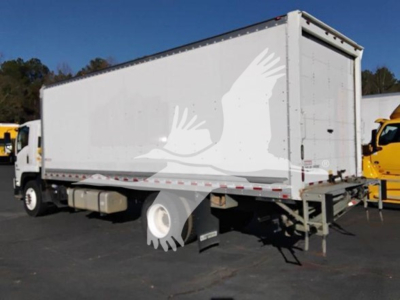 Isuzu FTR box truck side view showing white trailer with gull graphic and rear access doors.