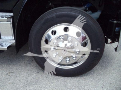 Freightliner M2 106 wheel and tire with chrome hub and lug nuts visible in front wheel well.