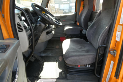 Interior view of a 2021 Peterbilt 579 day cab showing black fabric seats, steering wheel, and dashboard.