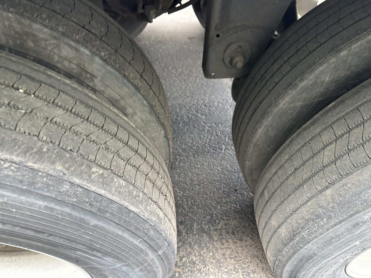 Trailer axle view showing dual tires and suspension underside for a 2019 Utility 4000D-X trailer.
