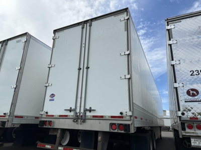 Trailer rear view showing two hinged doors and metal bay with dual rear lights and reflectors.