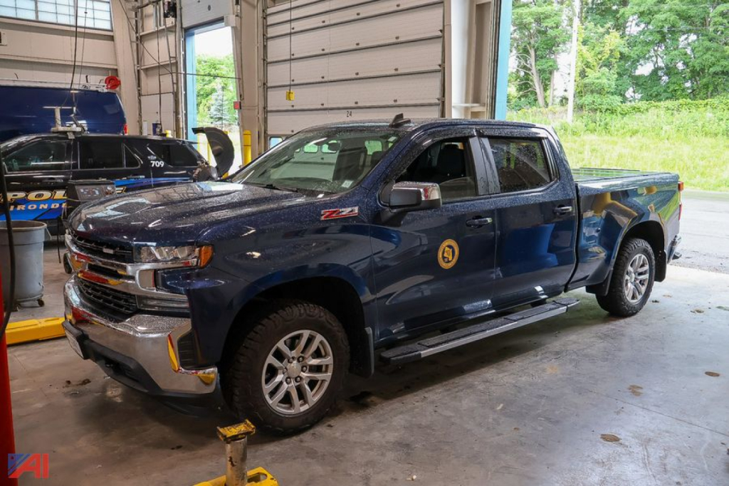 Chevrolet Silverado 1500 Crew Cab pickup truck in a shop bay showing front-left profile with Z71 badge and Silverado badge
