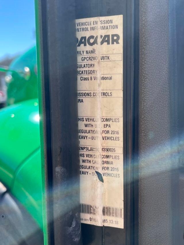 Vehicle emission control information label on a Peterbilt truck door jamb with text including BACAR and EPA compliance statements.