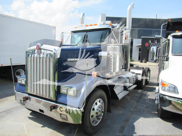 Kenworth W900L conventionally styled truck showing chrome grille and blue cab.