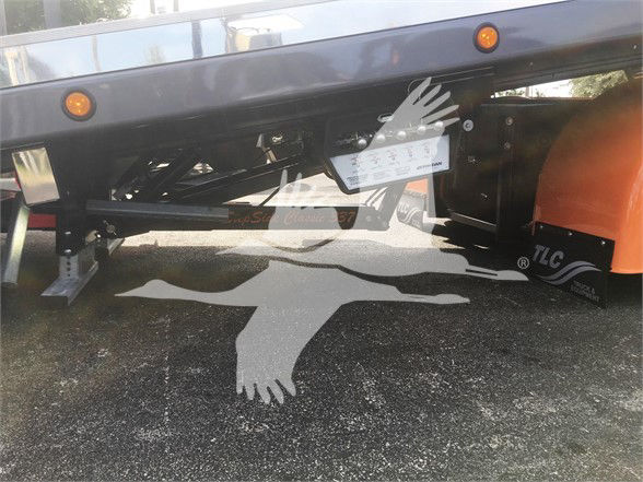 Peterbilt truck frame undercarriage with label plate visible; text on plate legible but small