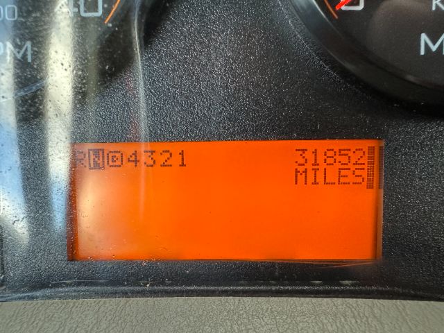 Instrument cluster display showing odometer reading 31552 miles and a code RQ0421 on the left.