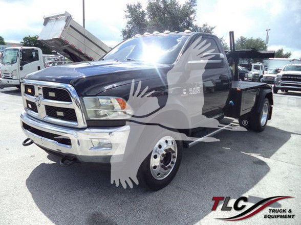 Ram 4500 tow truck with black and chrome front, extended cab, watermark of TLC Truck & Equipment obstructing center,