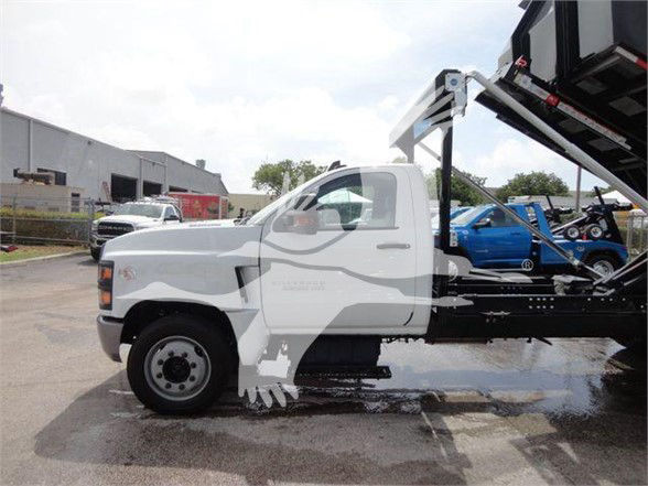 Chevrolet Silverado 5500HD tow truck in white side view showing chassis and hydraulic bed