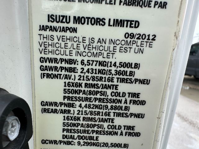 Isuzu NPR-HD vehicle data plate with GVWR/PNBV and GAWR values, tire sizes 215/85R16E, front and rear cold tire pressures, and 550 kPa Cold Tire Pressure label.