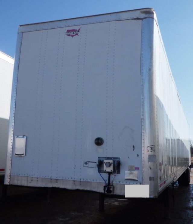 Rear view of 2014 Wabash dry van trailer with standard rear doors and coupling hardware.