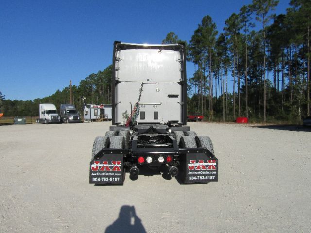 Kenworth T680 tractor cab and chassis rear view showing fifth wheel and dual rear axles.