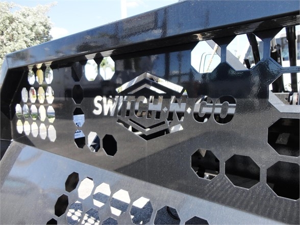 Ram 5500 HD truck front grille with Switch-N-Go branding and honeycomb cutouts.