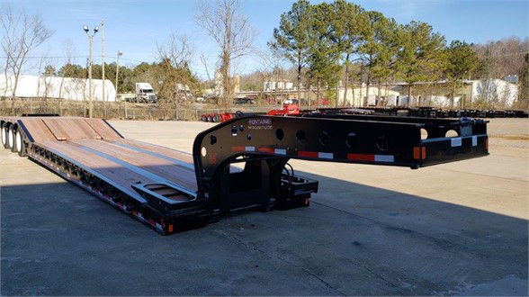 Fontaine lowboy trailer showing long deck with dual axles and a gooseneck/neck area. Brand text on neck reads Fontaine.