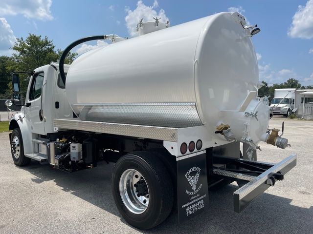 2013 Freightliner M2 sewer rodder septic truck with large white vacuum tank and rear hose fittings.