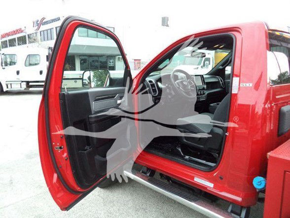 Ram 4500 SLT truck interior and open driver door showing cab with black seats and steering wheel from outside.