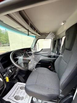 Kenworth T880 truck interior showing driver seat and dashboard area.
