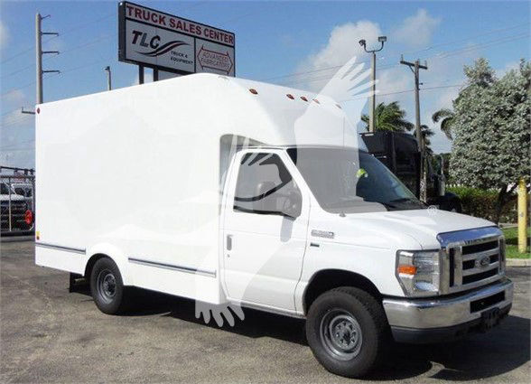 Box truck, 2015 Ford E350 SD, white cargo area with cab, stock photo at a truck sales lot.