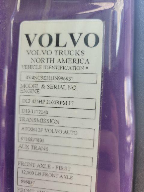 Volvo Trucks North America VIN sticker on a purple door: VIN 4V4NC9EH1JN996837, model/serial and engine details, transmission, front axle - first, 12,500 lb front axle capacity.
