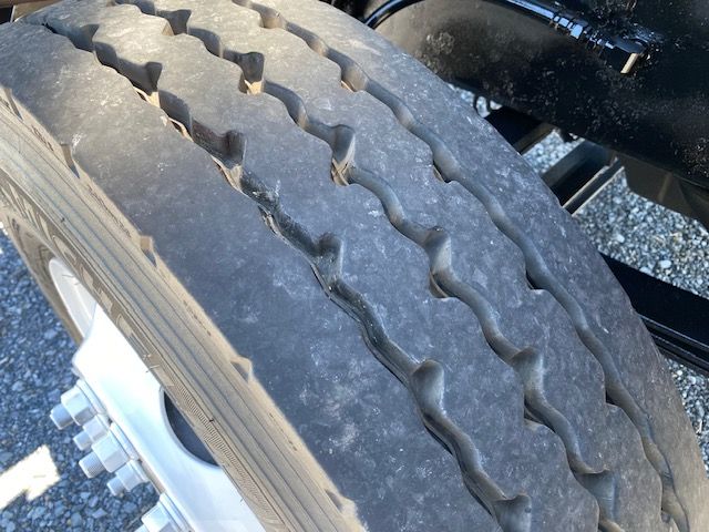 Truck wheel close-up showing tire tread and rim.