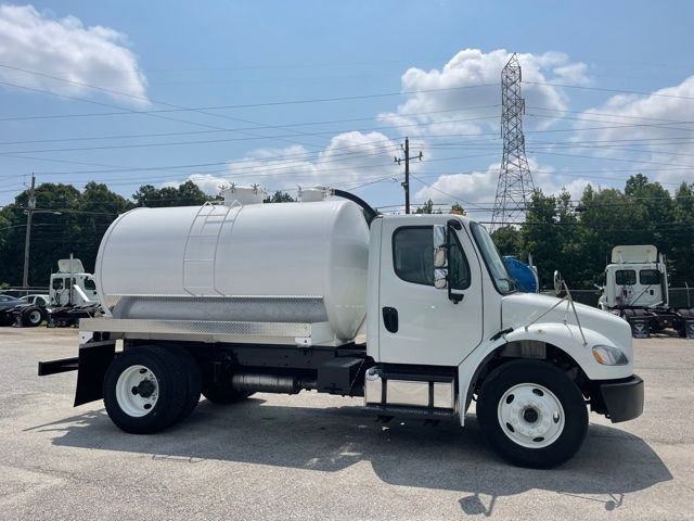 2015 Freightliner M2 sewer/vacuum truck with large cylindrical tank mounted on chassis, white cab and tank, side door, dual rear wheels, in an outdoor lot.