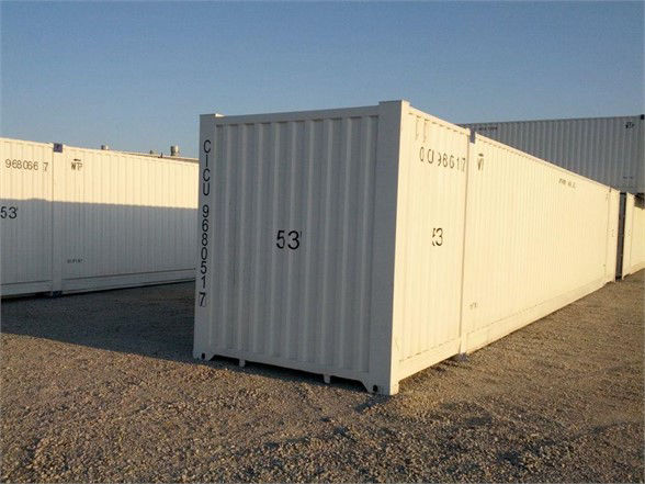 53' white CIMC shipping container in an outdoor lot showing side and front numbers.
