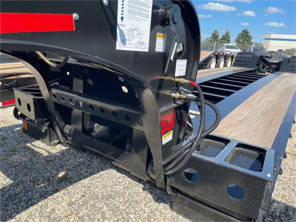 Fontaine 55 ton steel lowboy trailer with 26ft deck showing hydraulic lines and frame near hitch.
