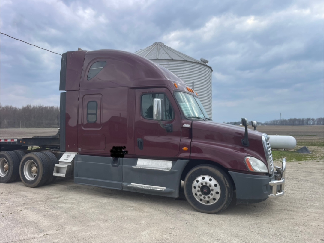 Maroon 2014 Freightliner Cascadia 125 conventional sleeper semi-truck side view showing long hood, sleeper cab, aluminum wheels, and dual rear axles.