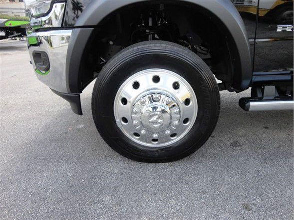 Front wheel and hub area of a 2024 Ram 4500 HD SLT showing a chrome wheel.
