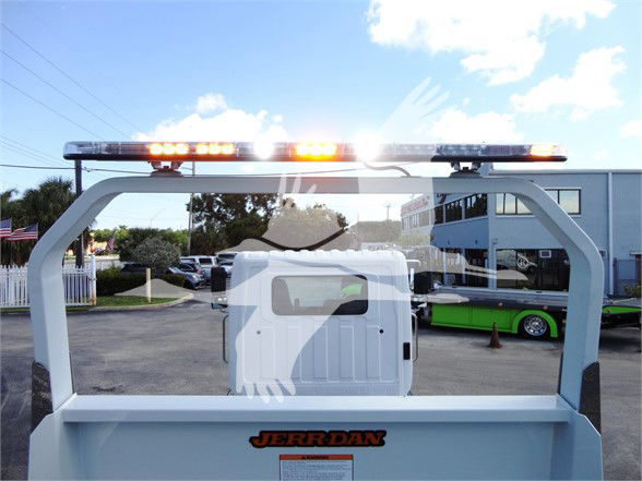 Truck bed of a 2022 Hino 268A with orange warning lights on top and JERR-DAN branding on the bed.
