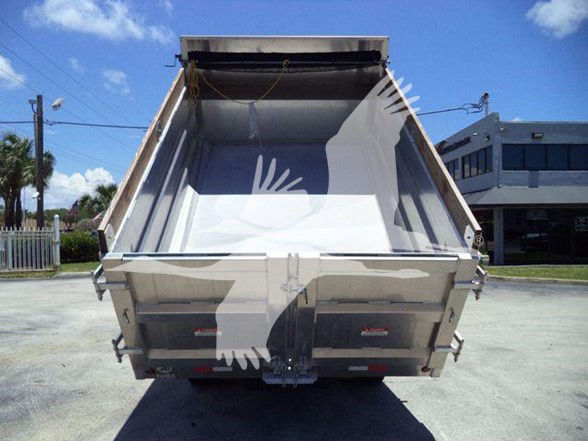 Isuzu NQR dump truck bed in rear view, open cargo bed showing metal sides and tailgate, chrome latches, rear bumper, and hydraulic area.